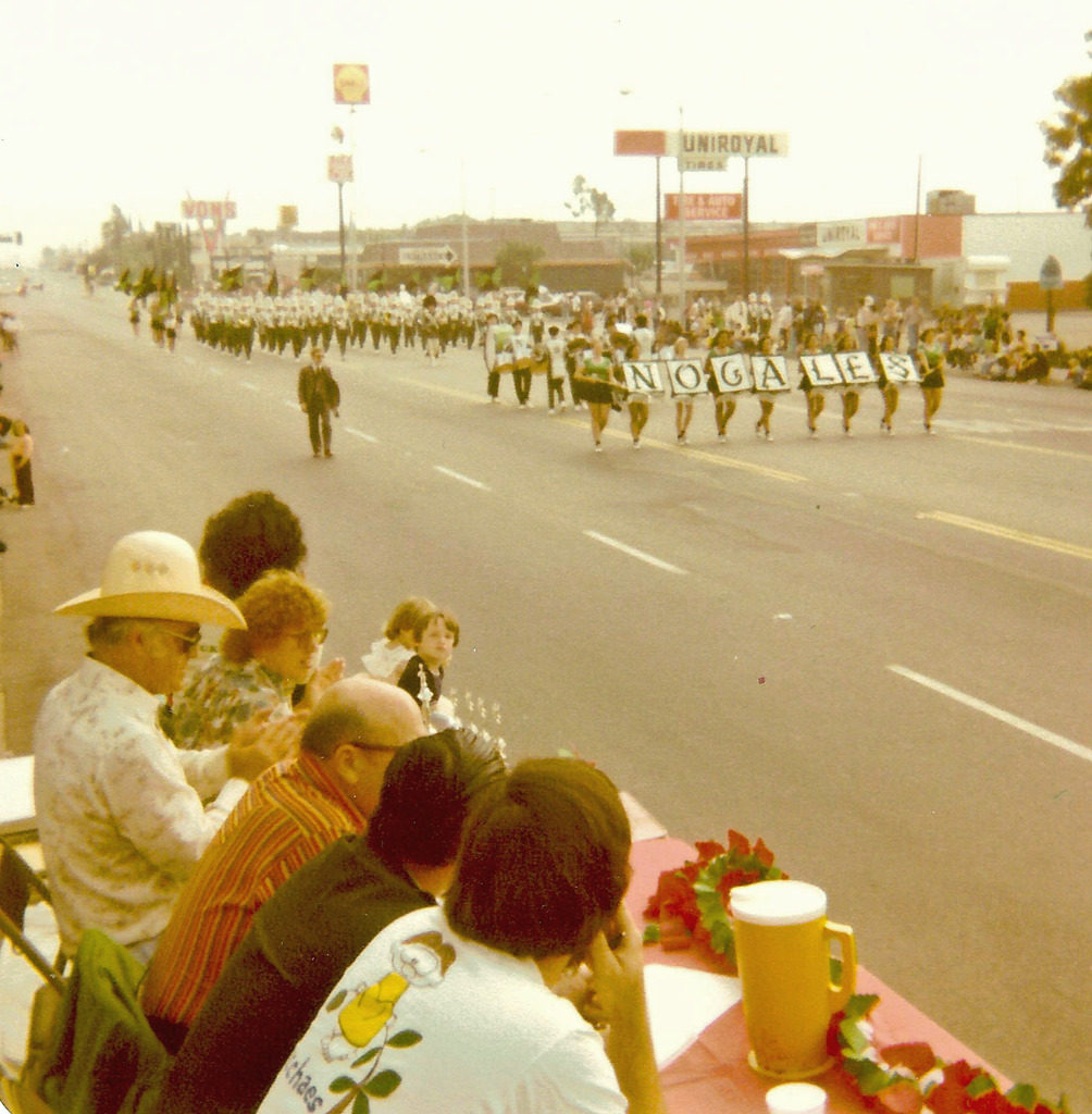 An old image of people watching the parade