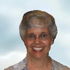 A smiling woman with short graying hair