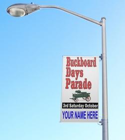 Buckboard Days Parade banner on a lamppost